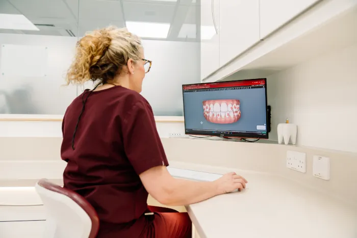 A clinician reviewing a digital smile design on a screen at Broad Street Dental