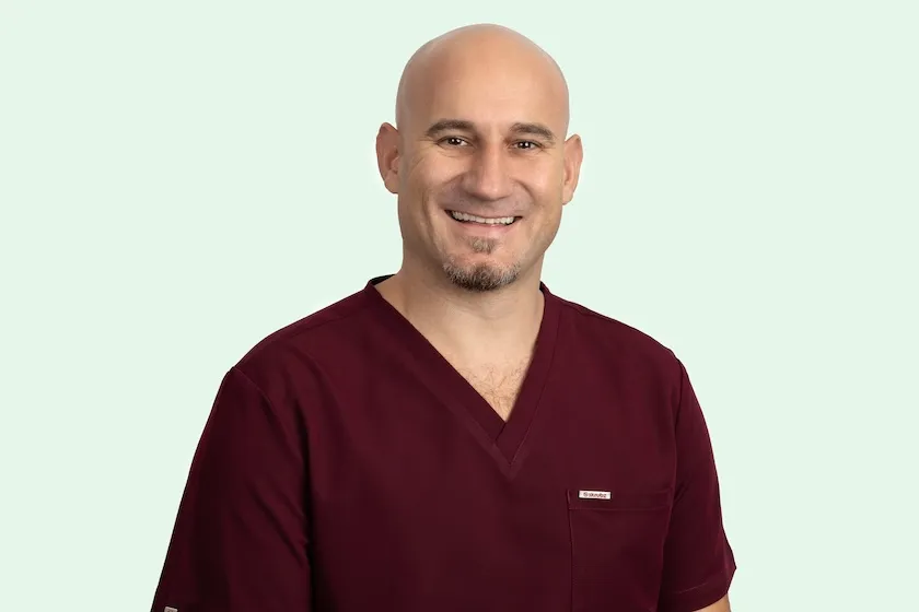 Dr Ivo Raitchev, Clinical Director at Broad Street Dental, in practice scrubs